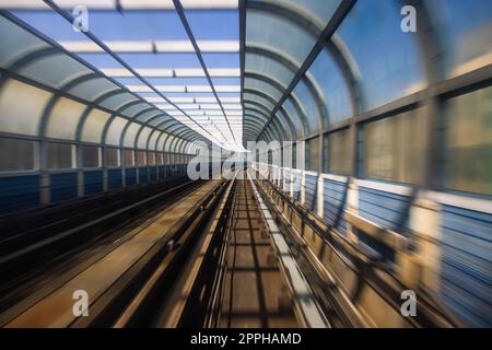 Motion blur of train moving inside tunnel Stock Photo