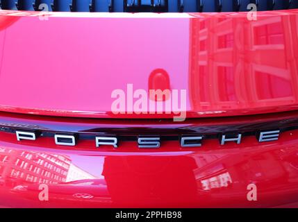 Kiel, Germany - 16. October 2022: Logo of the car company Porsche on a new sportscar. Stock Photo