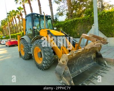 Mini bulldozer or excavation or loader on road. Stock Photo