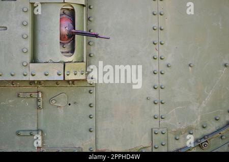 The texture of the wall of the tank, made of metal and reinforced with a multitude of bolts and rivets. Images of the covering of a combat vehicle from the Second World War with a guided machine gun Stock Photo