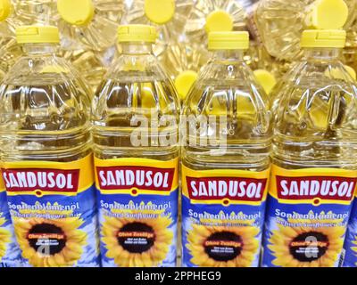 Kiel, Germany - 03. October 2022: Numerous bottles of vegetable oil for cooking and frying on a supermarket shelf. Stock Photo