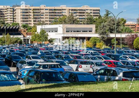 MADRID, SPAIN - OCTOBER 6, 2021: Building of the Faculty of Medicine of the Autonomous University of Madrid (Universidad Autonoma de Madrid), with the parking lot full of vehicles Stock Photo