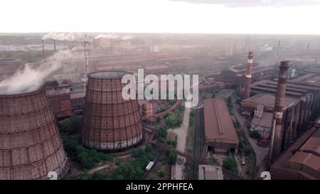 Metallurgical factory with chimneys and smog. Industrial plant for steelworks, ironworks or metalworks as heavy industry background. download image Stock Photo