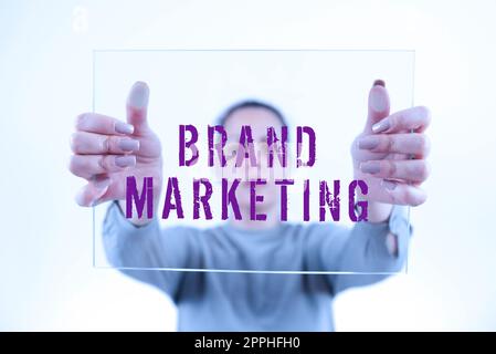 Text sign showing Brand Marketing. Word Written on the practice of approaching customers to build a better image Stock Photo