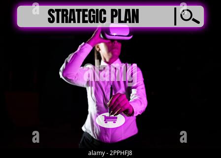 Hand writing sign Strategic Plan. Internet Concept the leadership and business command Coaching Competition Businessman Presenting Digital S And Display With Crucial Information. Stock Photo