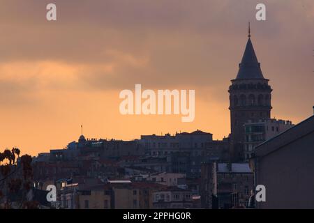 Galata Tower, in Istambul, Turkey, silhouetted against the twilight sky. Stock Photo