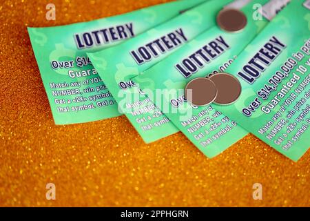 Close up view of green lottery scratch cards. Many used fake instant lottery tickets with gambling results. Gambling addiction Stock Photo