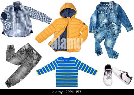 Collage set of little boys autumn clothes isolated on a white background. Denim trousers and jacket, sneaker, a down jacket, pants and shirts for child boy. Children's winter fashion. Stock Photo