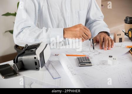 Architectural building design and construction plans with blueprints paper project plans Stock Photo