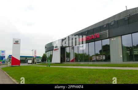 Nissan dealership sign in front of showroom store Japanese brand Stock Photo