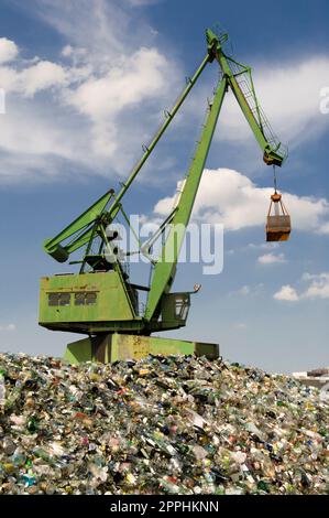 A crane in the eastern harbour of Frankfurt am Main at a recycling and collection point for used glass Stock Photo