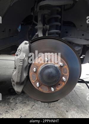 brake discs on the machine with the removed wheels on the jacks. wheel replacement Stock Photo