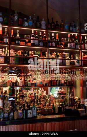 Various alcohol bottles displayed in a pub Stock Photo