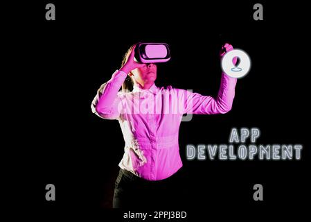 Text showing inspiration App Development. Concept meaning gathering of showing for the purpose of discussing an issue Woman Holding Pen During Professional Training Through Vr Headset. Stock Photo