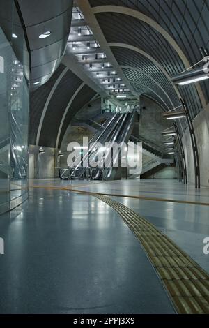 Futuristic subway station with guiding lines and an escalator near Heumarkt in Cologne, Germany Stock Photo