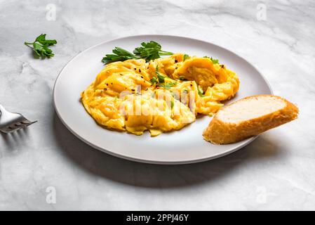 Scrambled Eggs for breakfast, copy space. Keto food, healthy breakfast with scrambled egg. Stock Photo