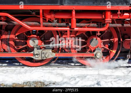 Wheels and rods on a steam train locomotive of Brockenbahn railway on Brocken mountain in Germany Stock Photo