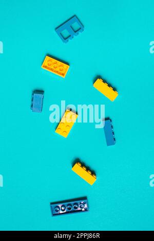 Constructor children plastic multi-colored on a pastel blue Stock Photo
