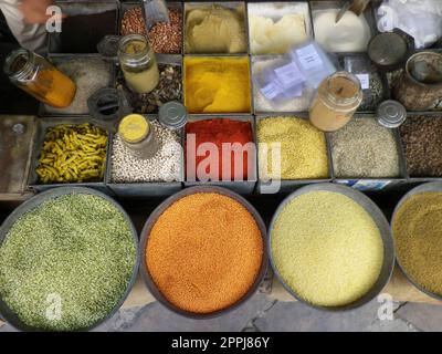 Spices and herbs background. Condiments on  table Stock Photo