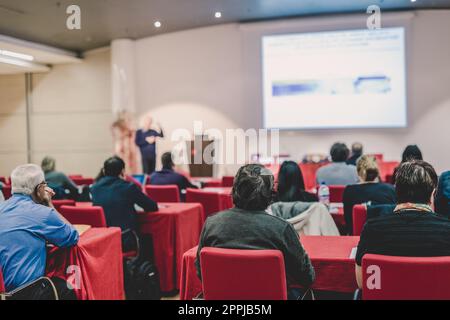 Audience in lecture hall on scientific conference. Stock Photo