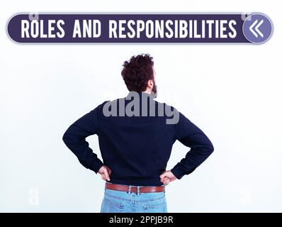 Hand writing sign Roles And Responsibilities. Word Written on Business functions and professional duties Stock Photo