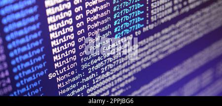 Macro snapshot of the program interface for crypto currency mining on the monitor of an office computer. The concept of mining bitcoins. The flow of information strings and data Stock Photo