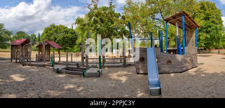 Panoramic view of playground with various climbing and playing facilities and sandbox Stock Photo