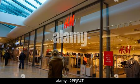 Baden-Baden, Germany - January 01, 2022: Logo sign on the wall of H M shop at Baden-Baden Stock Photo