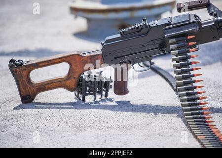 Machine gun belt loaded with cartridges Stock Photo