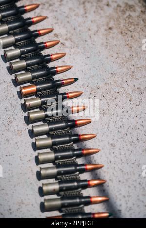 Machine gun belt loaded with cartridges Stock Photo