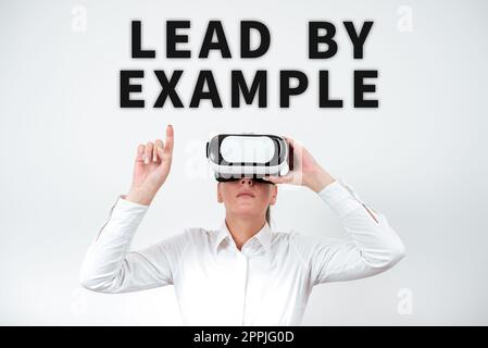 Writing displaying text Lead By Example. Business overview Be a mentor leader follow the rules give examples Coach Stock Photo