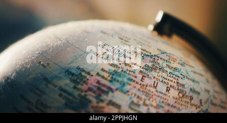 Extreme close-up of a globe centred on the UK and west Europe Stock Photo