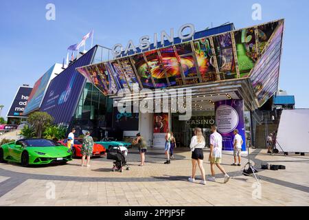 CANNES, FRANCE - JUNE 17, 2022: Casino Barriere Le Croisette and luxury cars in Cannes, France Stock Photo