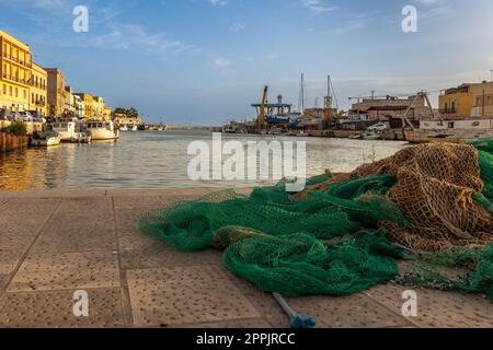 Old fishing nets on the pier Stock Photo - Alamy