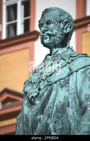 The monument to King Maximilian II of Bavaria stands in front of the Old Palace in Bayreuth on the courtyard. The statue of the Maximiliansdenkmal was cast in 1860 and stands on a granite base. Stock Photo