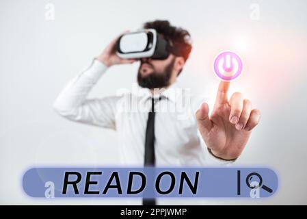 Conceptual caption Read On. Word Written on spend time reading in order to find out information about something Stock Photo