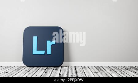 Lightroom App Icon on Wooden Floor Against Wall Stock Photo