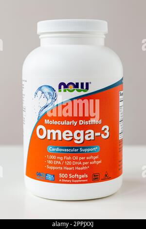 Kyiv, Ukraine - 27 January 2022: Now Foods Omega-3 natural fish oil concentrate - purified at the molecular level. Jar with of omega capsules for cardiovascular support from Natural Organic Wholesome. Stock Photo
