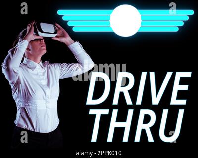 Sign displaying Drive Thru. Concept meaning place where you can get type of service by driving through it Stock Photo