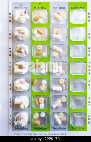 SureMed by Omnicell weekly pill pack filled with tablets issued by Weldricks pharmacy to help with complex medicine regimes Stock Photo