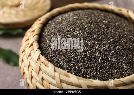 Wicker box with chia seeds on table, closeup Stock Photo