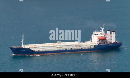 Loaded cargo ship named APRIL DREAM passing Bosporus in a summer day, Istanbul, Turkey Stock Photo