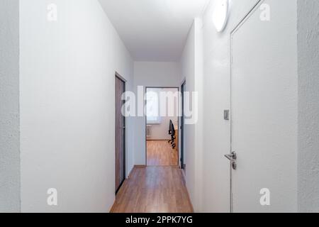 long corridor in a panel apartment Stock Photo