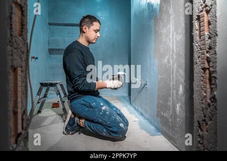 application of insulation to the wall against moisture and water Stock Photo