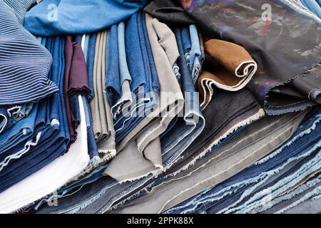 Samples of cloth and fabrics in different colors found at a fabrics market in Germany Stock Photo