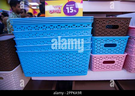 Colorful plastic baskets for sale in a market Stock Photo