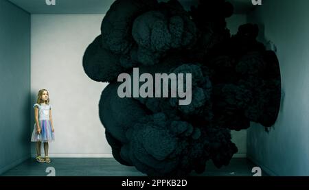 child in a room filled with black smoke Stock Photo