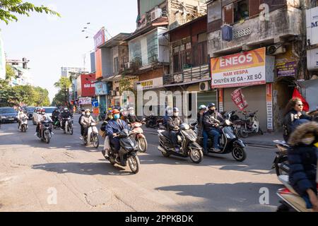 the chaotic traffic of mopeds in Hanoi, Vietnam. Stock Photo