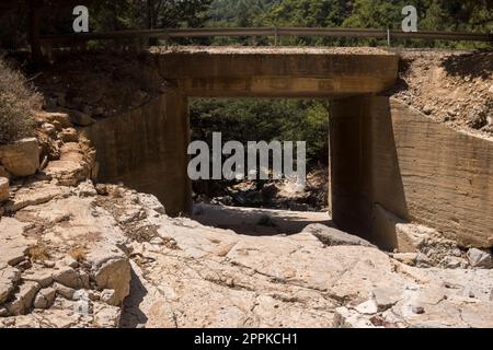 bridge over an empty valley of a small stream Stock Photo