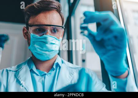 Doctor in the laboratory analyzes samples for scientific research Stock Photo